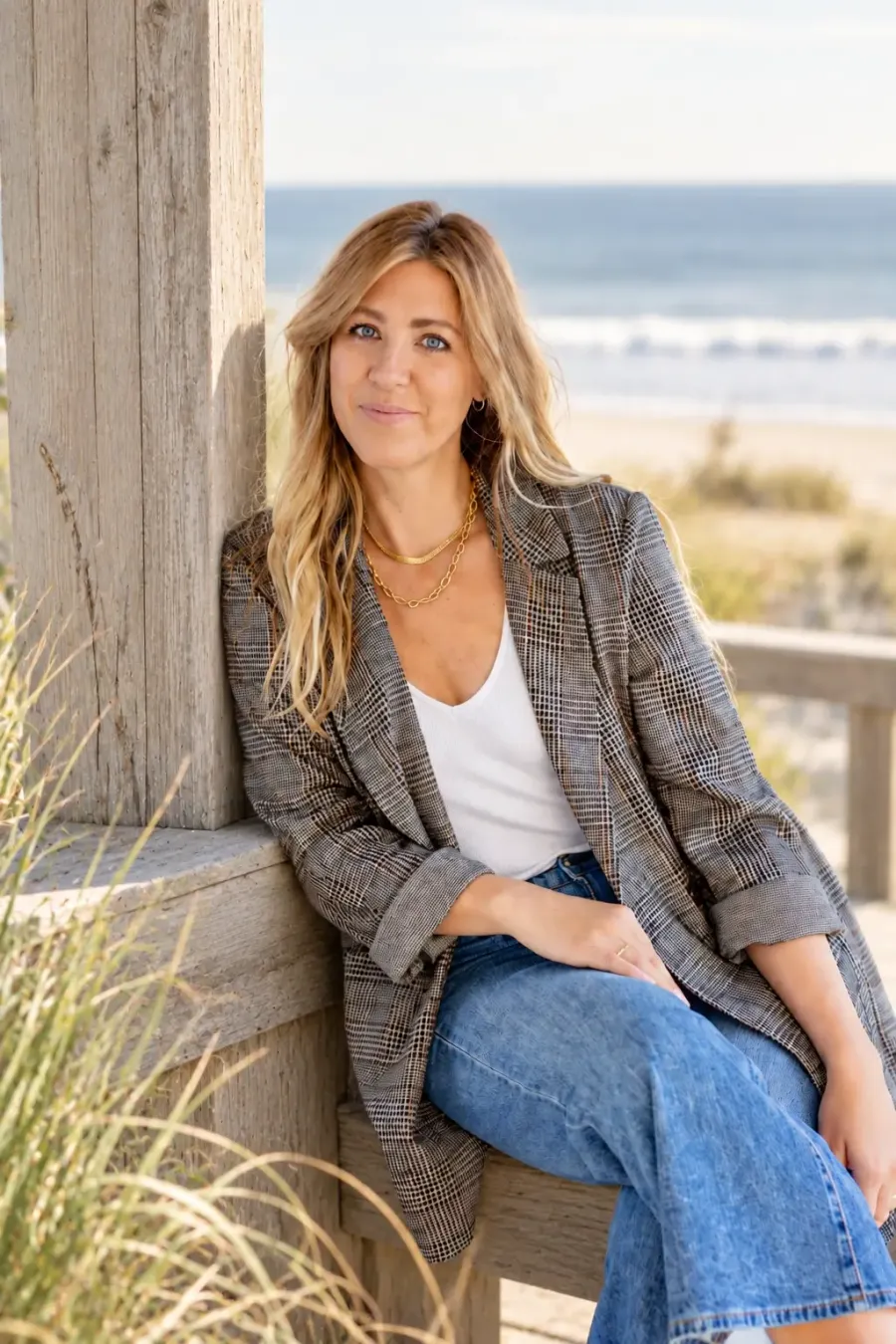 Erin Flynn by the water in warm evening light